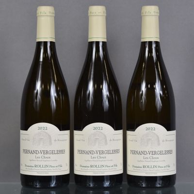 three bottles of wine sitting on top of a table next to each other