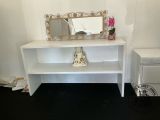 a white shelf with a mirror and a vase on it
