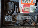 a black case with a radio and other items in it