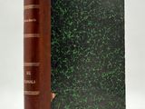 a book with a green cover sitting on top of a white surface