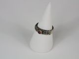 a close up of a white cone with a ring on it