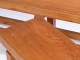 two wooden benches sitting next to each other on a white surface
