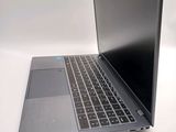 a laptop that is sitting on a white table