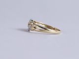 an image of a diamond ring on a white surface
