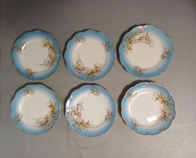 six blue and white plates with floral designs on them on a table