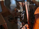 a large orange machine that is sitting in a room