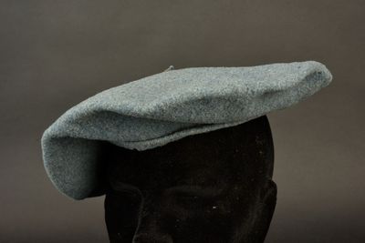 a hat on a mannequin head on a table