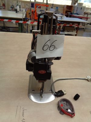 a machine that is sitting on a table with a sign on it