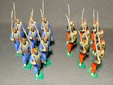 several figurines of men dressed in blue and orange uniforms