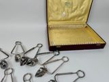a bunch of scissors in a case on a table
