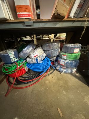 a pile of wires and hoses sitting on the floor