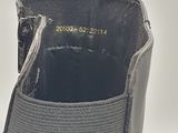 a close up of a pair of shoes on a white surface