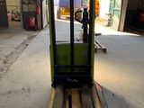 a fork lift truck that is parked in a garage