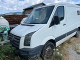 a white van that is parked in the grass