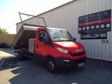 a red truck that is parked in front of a building