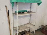 a shelf that has a green cover on top of it