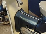 two mopeds parked next to each other in a room