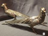 pair of antique brass pheasants on a grey background