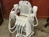 a machine that is sitting in a room with a laptop on top of it