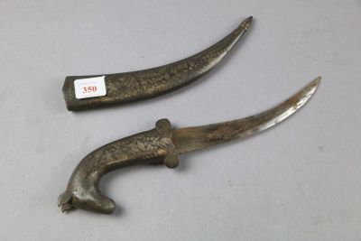 two old knives that have been left on the table