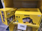 two yellow boxes of vacuum cleaners on a shelf in a store