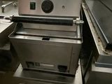 an image of a commercial kitchen with stainless steel appliances