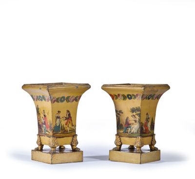 pair of vases with figures painted on the sides of them