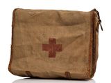 an old medical bag with a red cross on it