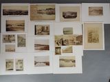 a lot of old photos on the wall of a room
