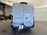 a white van that is parked in a garage