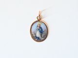 a picture of a woman holding a baby in her lapel