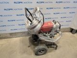 an image of a small lawn mower with a hose attached to it
