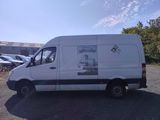a white van that is parked in the parking lot