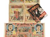 several old comic books are on display on a white surface