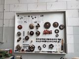 a picture of a wall with a bunch of tools on it