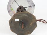 a small glass ball with a wire attached to it
