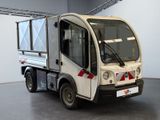 a small truck that is parked inside of a building