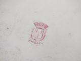 an image of a plate with a red design on it