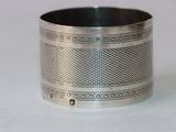 a close up of a silver bracelet on a table
