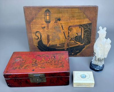 a small box with a statue of a man and a box with a statue of a man