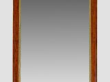 a large antique mirror with a wooden frame and gold trimmings