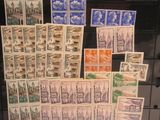 many different stamps on display in a display case