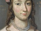 portrait of a woman in a blue dress with pearls and a pearl necklace