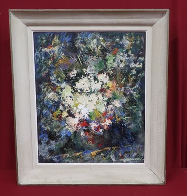 painting of white flowers in a white frame on a red wall