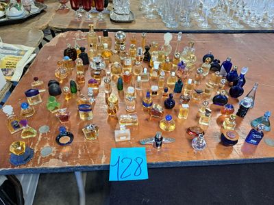 a table with a lot of perfume bottles on it