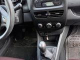 the interior of a car with a steering wheel and dashboard controls