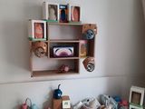 a table with a shelf and a shelf with bowls and other items on it