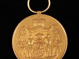 l'image d'une médaille d'or sur fond noir