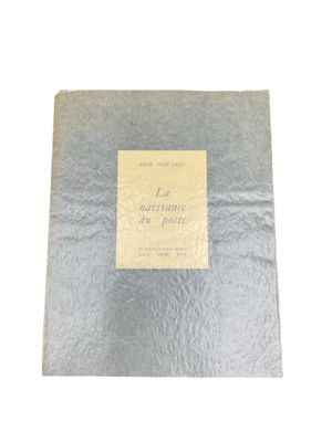 an old book with a label on it sitting on top of a table