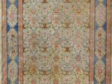 an antique rug with a blue border and a gold border
